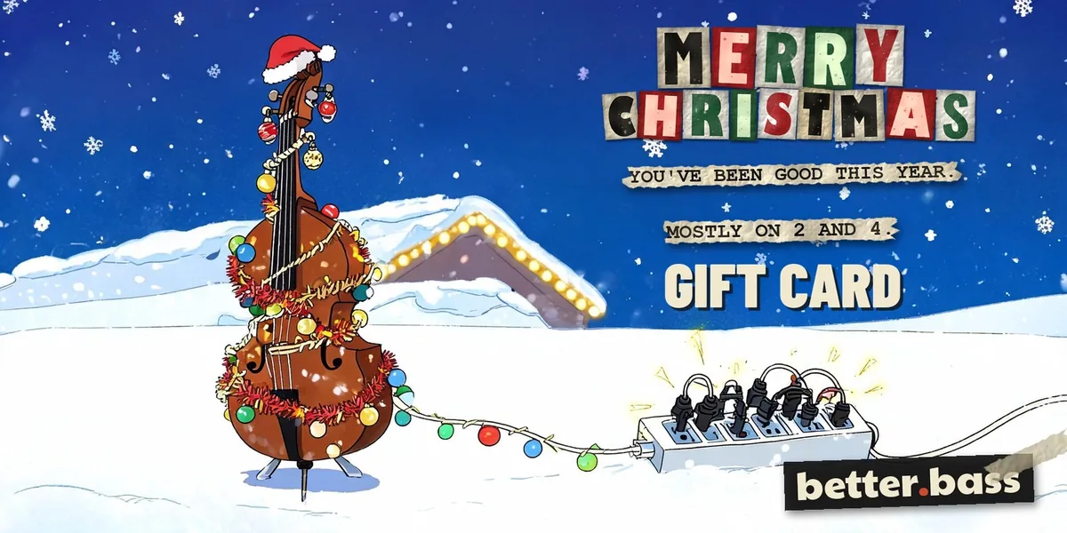 Better Bass Lessons Holiday gift card: a cartoon upright bass wrapped in Christmas lights in the snow, with Merry Christmas in cut-out letters